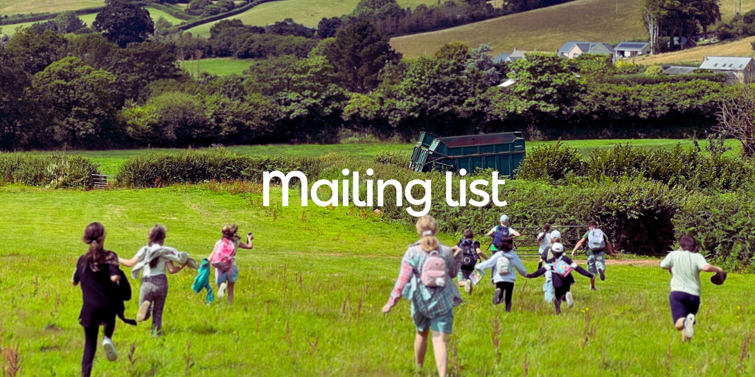 Children running down a field, overlaid with the test 'Mailing list''