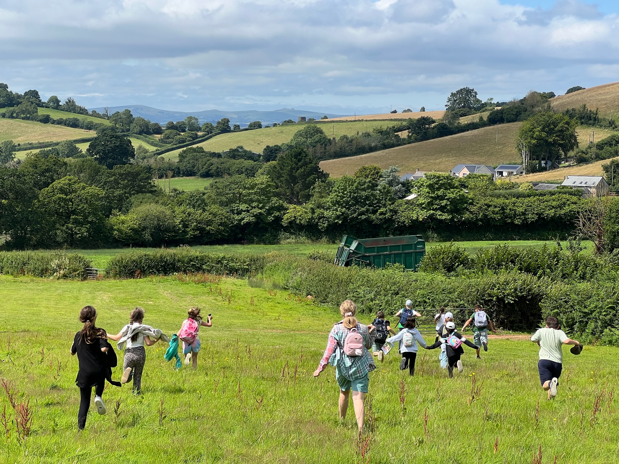 Children running down a field (2024)