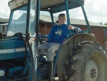 Student in a tractor
