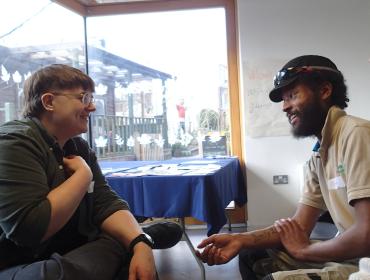 Two members chatting at Vauxhall City Farm