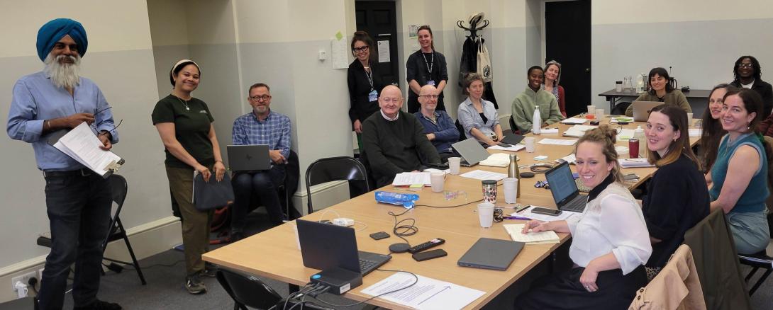 a group of people having a meeting smile for the camera