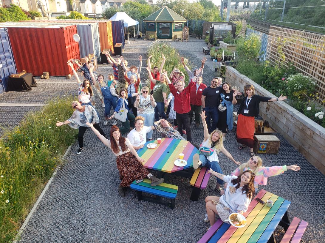 Community groups with arms out - Green Squirrel, Cardiff